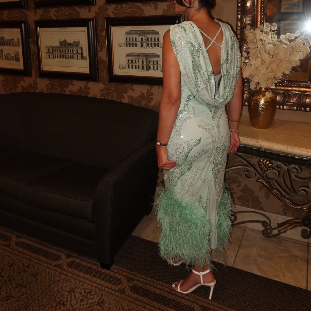 Elegant Green Evening Gown with Feather Details